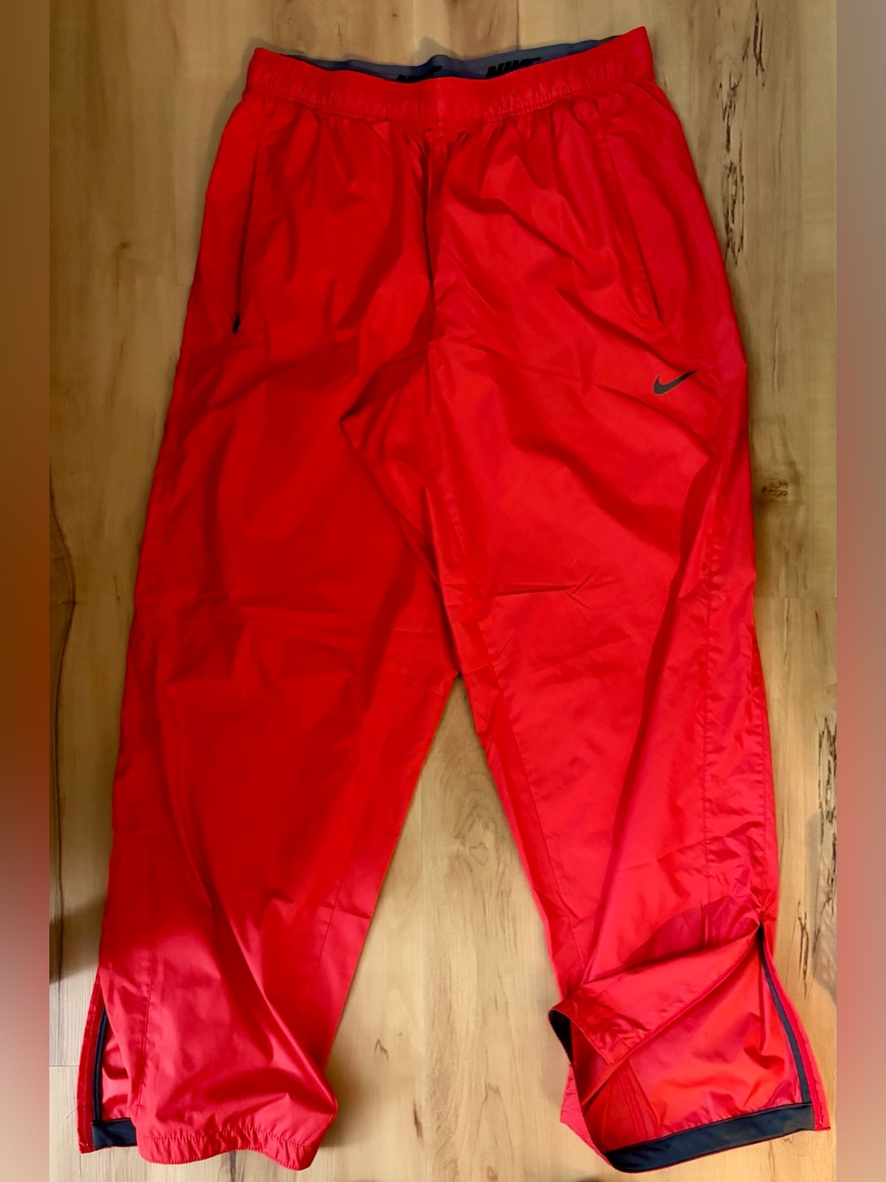 Nike Storm-Fit pants with leg zippers and drawstring waist